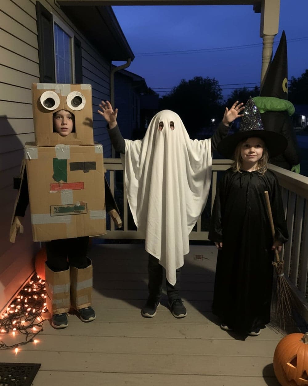 Three kids, one porch, one flash — the photograph as it was sent in